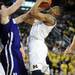 Michigan freshman Trey Burke looks to shoot around Northwestern freshman Dave Sobolewski in the second half against Northwestern at Crisler Center on Wedensday. Melanie Maxwell I AnnArbor.com